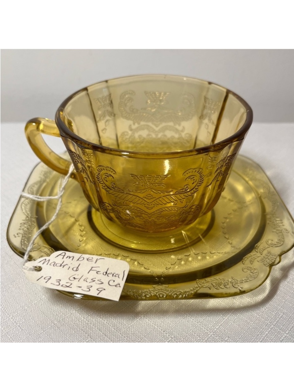 Federal Glass Madrid Amber Depression Glass Cup and Saucer set, 1932 - 1939.